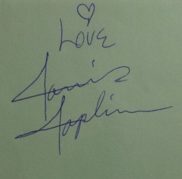 This vintage cut of light green paper measures approximately 4.5x5.5" and is in NM condition.  It is blue ink-signed by 1960's rock icon and singer, Janis Joplin.  The signature grades a legible 8 with "LOVE" and a heart included, and with her death now 53 years ago, this cut is valued well into the hundreds.  Combine with the photo or album of your choice for a superb display!