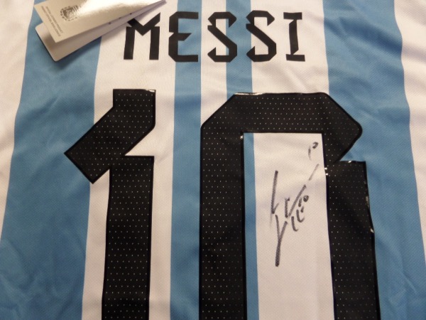 This gorgeous authentic-style team Argentina jersey is blue and white and comes signed by the best ever in black with his #10 and LEO included!  Guaranteed authentic and since the World Cup his retail prices have risen way into the low thousands++. 