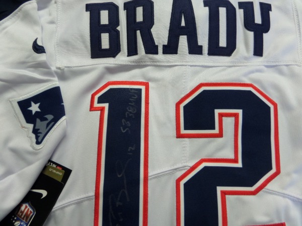 This mint home white Pat's jersey is authentic with sewn on name & numbers and comes signed by the GOAT on the back in silver with his #12 and "SB 38 MVP" included!  Shows off wonderfully, guaranteed authentic, and retails in the mid thousands and rising as he is most likely done forever and won't do many (if any) shows now. 