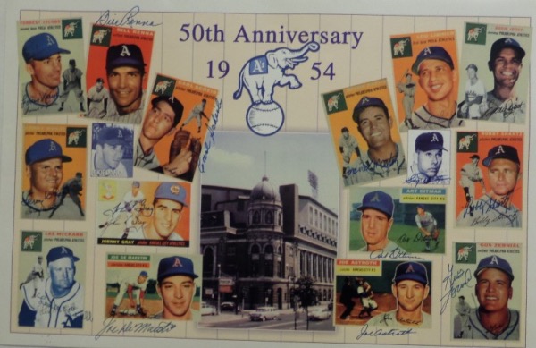 This 11x17 full color poster print is for the 2004 Philadelphia Athletics 50th Anniversary Reunion.  It shows color images of 15 players, and is hand-signed in blue by 14 of them.  Included are Bobby Shantz, Eddie Joost, Gus Zernial, Joe Astroth, Art Ditmar, Carl Scheib, Forrest Jacobs, and more--please see our attached photo--and with so many of these A's great no longer living, retail is mid/high hundreds!