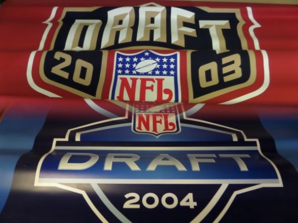 No serious football collection would be complete without these gorgeous and 100% authentic banners from the NFL Draft in Madison Square Garden.  Each measures a sizable 30" tall by 45" wide, and were actually used during the drafts.  There is a blue one and a red one and boy, will these pieces absolutely shine in your football collection, display, or man cave!