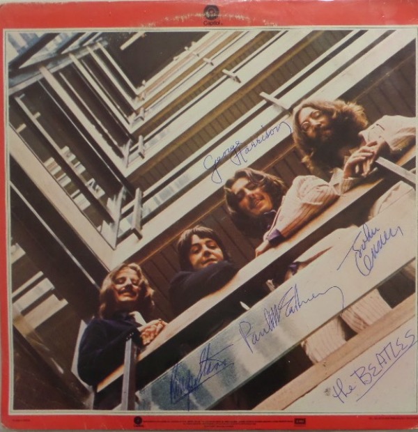 This 1960's LP is "1962-1966" an shows all 4 rock stars on the cover jacket. It is in fine++ overall condition, comes blue ink signed by everyone, and the 4 high value autographs grade clean bold 9's, and show off well from 15 feet away. Great buy and hold "Great American" investment, and just look at the always low stating bid pricing. 