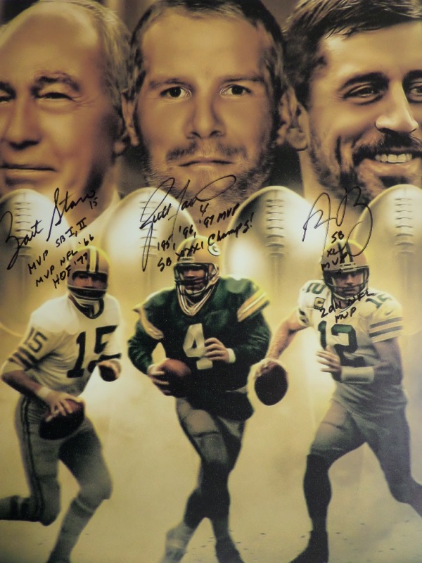This stunning 16x20 work is done in team colors, shows the 3-HOF star QBs in action and in poses, and comes perfectly black sharpie signed by Bart Starr, Brett Favre and Aaron Rodgers. It grades a 10 all over, begs to be matted, framed and shown off, and value on this quality print is close to 2 grand.