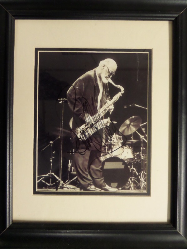 When it comes to jazz music, there really are no living legends left ... oh wait, except for this guy!  This 14.5x17.5 framed and double matted display features a black and white photo that is hand-signed by living tenor sax legend, Sonny Rollins.  Autograph is a legible 8, and this guy is now 92 years-old, so if he is still signing, it probably doesn't look like this anymore.  No jazz collection would be complete without Rollins!