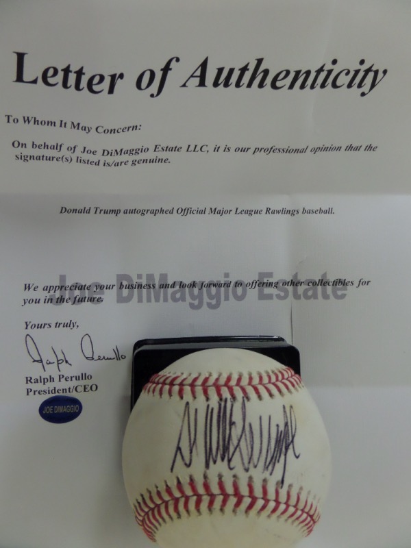 This Official Major League Baseball from Rawlings was used in actual MLB action, and is cubed in VG+/EX overall condition.  It is hand-signed across the sweet spot in black ink by 45th US President, Donald Trump, and though the signature was obviously done quickly, it still grades about a 7 overall, and comes certified by The Joe DiMaggio Estate for certainty.  Valued into the low thousands!