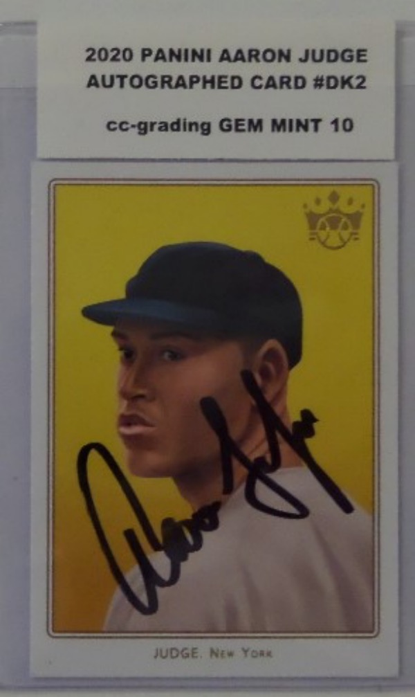 This card #DK2 from 2020 Panini is the AARON JUDGE Diamond King Card and comes AUTOGRAPHED by AARON in thin black sharpie across the front. Great card from the 2022 MVP and Best player in MLB, and value is HIGH on this beauty that comes GRADED GEM MINT 10 by CC-GRADING.