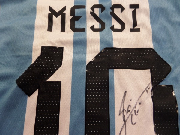 This gorgeous authentic-style team Argentina jersey is blue and white and comes signed by the best ever in black with his #10 and LEO included!  Guaranteed authentic and since the World Cup his retail prices have risen way into the low thousands++. 