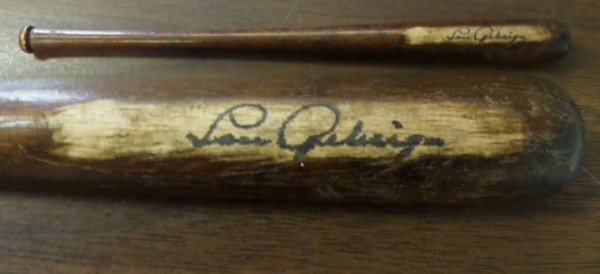 This vintage souvenir bat is dark brown in color and 16" long. It is circa 1920's and in nice shape with the spot where Lou signed sanded off to be light so you can read the black ink signature!  Lou signed in vintage black dip ink and the autograph shows off superbly and is RARE on this gem with a book value well into the 5 figures. 