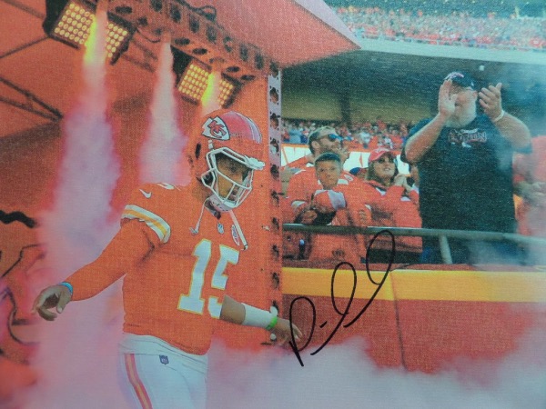 This awesome work is on real canvas, measures 20x20 square, and shows the NFL MVP on the field. It comes black marker signed by Mahomes perfectly, grades a 10 all over the place, and is valued at $1500.00 or so. 