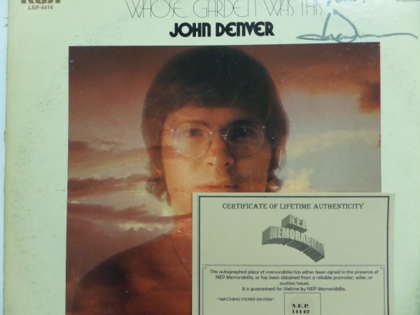 This 1970 classic from singer/songwriter John Denver is titled "Whose Garden Was This" and comes to us in VG+/EX overall condition.  It is front cover-signed in black felt marker by the longtime troubadour himself, grading a legible 6 with Peace! added, and retail since his death is well into the hundreds!  N.E.P. Memorabilia COA included!