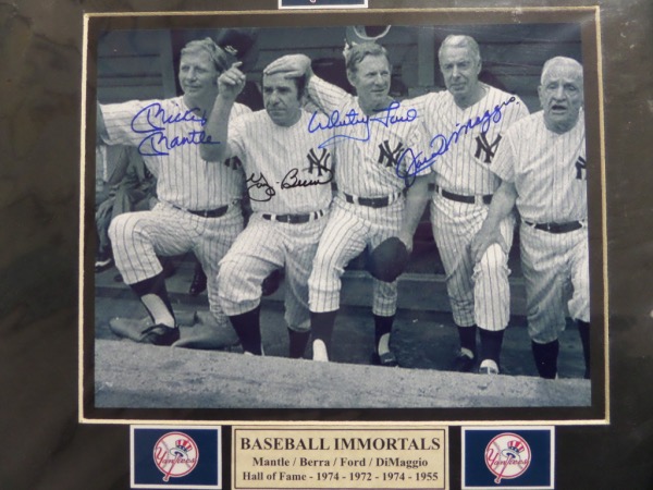 This awesome matted display holds a black and blue sharpie signed B&W 8x10 of  Whitey, Yogi, Joe and Mickey, and measures near 11x14 in size with team logos added. It grades a clean bold 10 all over, shows off well from 20 feet away, and as always, we'll sell it with NO reserve! Value is about $1500.00 on the Bronx Bombing four-some.