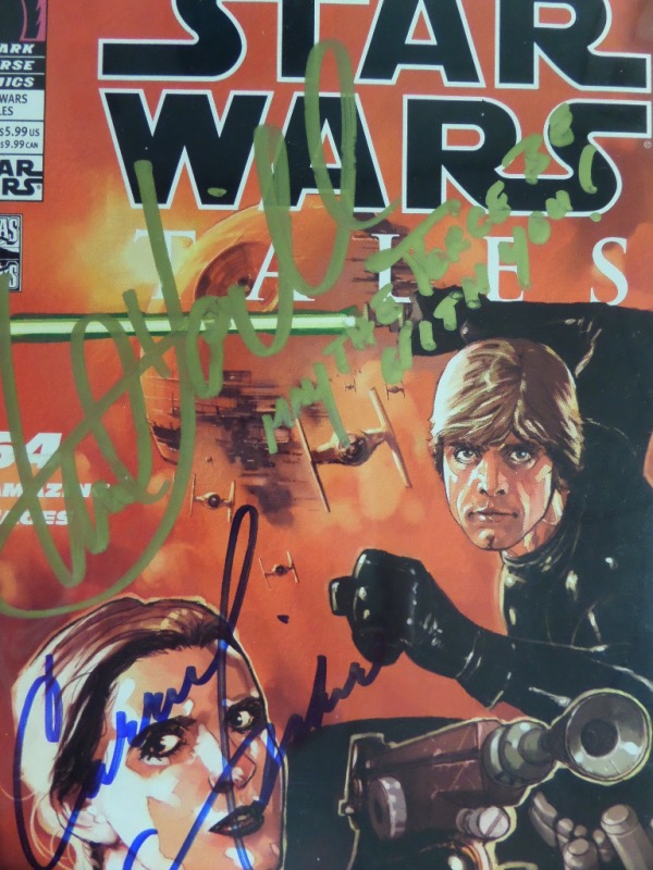 This awesome color covered comic book is from Lucas Books and Dark Horse Comics, and shows both "Luke Skywalker & Princess Leiha" on the cover. It comes hand signed by both Mark Hamill and Carrie Fisher boldly, grades as good as it gets, and value with both being VERY expensive, is over a grand. IN PERSON obtained by our consigner who's as good as gold. 