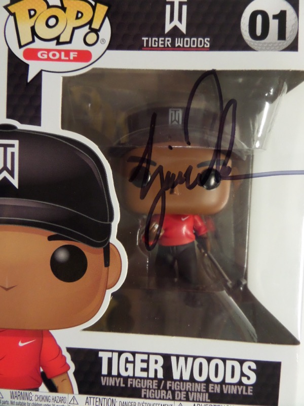 This new, boxed Funko is the Tiger Woods, and comes black sharpie signed on the cellophane. Great collectible, high value, and sold here at the "Corner" with NO reserve.  