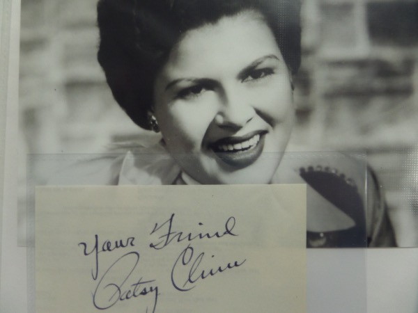 This cut of white paper measures 3x5, is still in gorgeous, NM condition, and comes hand-signed in black ink by the "Crazy" singer herself.  Signature is a legible 8, with Your Friend added as an inscription, and the piece comes with a black and white close up photo for display.  Valued well into the hundreds from this long-deceased music icon!