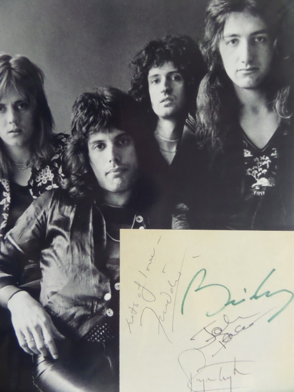 This large cut of  white paper measures approximately 4.25x4.75, a very large size for matting.  It features different signatures from all four members of HOF English rock band Queen, including Freddie Mercury (dec), John Deacon, Brian May and Roger Taylor, and is ideal for framing and display with the photo or album of your choosing.  Comes with a black and white 8x10 photo for matting and framing, and the retail potential here is sky high!