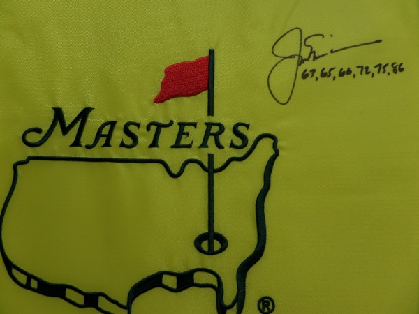 This yellow Masters logo pin flag is in MINT condition, and comes black sharpie-signed by the greatest golfer of ALL TIME, Jack Nicklaus.  The signature grades a legible 8, and includes an incredible inscription of the SIX different years that he took home the green jacket.  A fantastic PGA item, and retail is high hundreds!  BEAUTIFUL!