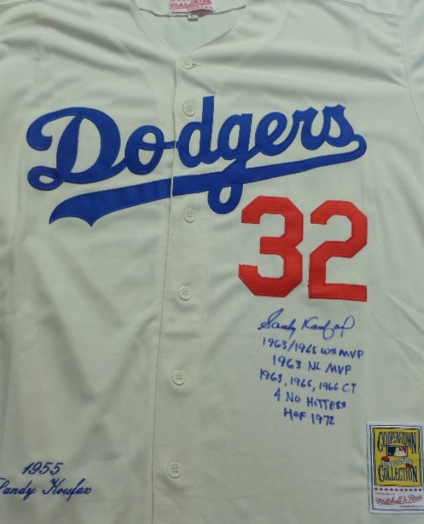 This size L home white 1955 Brooklyn Dodgers throwback jersey from Mitchell & Ness is trimmed in red and blue with everything sewn on, and comes front signed in blue sharpie by the great 3 time Cy Young Award Winner and HOF lefty!  The signature grades a legible 8.5, includes 4 No Hitters, 1963, 1965, 1966 Cy, HOF 1972, 1963/1965 WS MVP and 1963 NL MVP inscriptions, and will show off brilliantly in any baseball collection!
