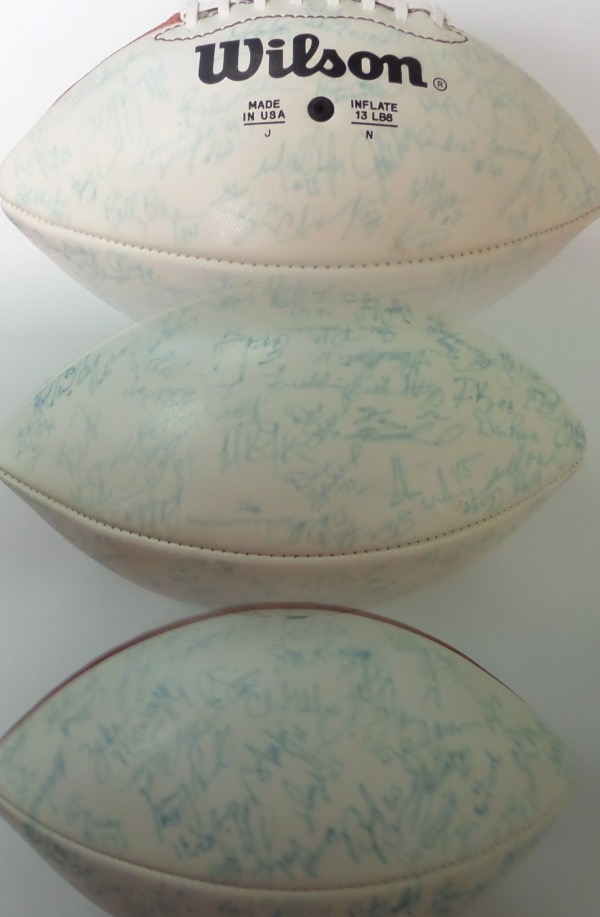 This full size, triple white panel football from Wilson is still in EX/EX+ condition, and comes hand-signed in blue on the white panels by more than SEVENTY participants of Super Bowl XXI.  Both Giants and Broncos players are represented here, and included are John Elway, Harry Carson, Phil Simmons, Mark Bavaro, OJ Anderson, Dan Reeves, Carl Banks, and many more--please see our attached triple image photo.  A JSA group LOA provides authenticity on this ball, and retail is low thousands!
