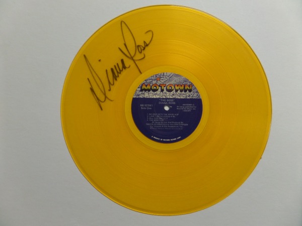 This unique collector's item is a MUST for Motown/Supremes fans.  It is an original 1979 "The Boss" record by Diana Ross, but this one is an eye-catching yellow color, and is is hand-signed in black sharpie by Diana herself.  The signature grades a legible 8, and this beauty will make for a fabulous addition to any music collection!