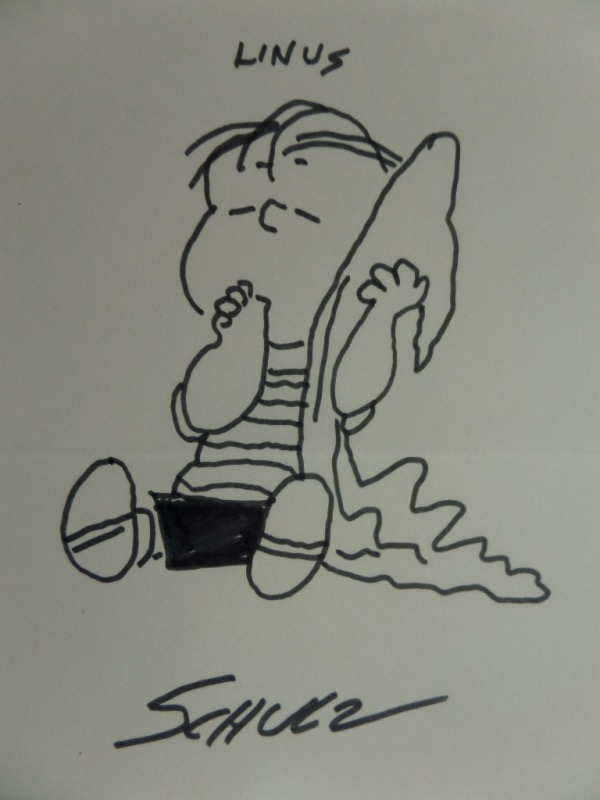 This super cool sketch is in bold black marker, shows the blanket carrying kid sucking his thumb, and comes hand signed by creator Charles Schulz. It is about 6x8 in size, shows off well from 18 feet away, and value on this circa 1977 work is $1200 or so. 