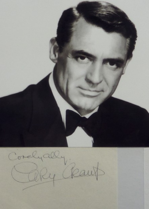 This cut of white paper measures about 3x5 in size, and comes hand-signed in black ink-signed by silver screen legend, Cary Grant.  The signature grades a 7 overall, complete with a Cordially inscription, and the cut is accompanied by a black and white photo for display.  Valued well into the hundreds!