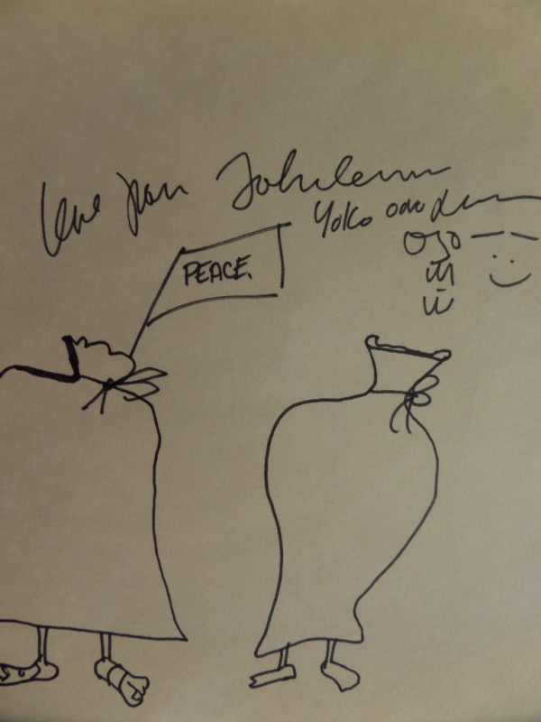 This super rare one of a kind is a near 9x9 square original work from John, and comes hand signed by he and his wife Yoko Ono across the top. It is a black marker sketch, shows some people with bags over their heads shouting "Peace", and grades a 10 all over the place. It has to be valued into the thousands, but we'll sell it here at the "Corner" with NO reserve. 