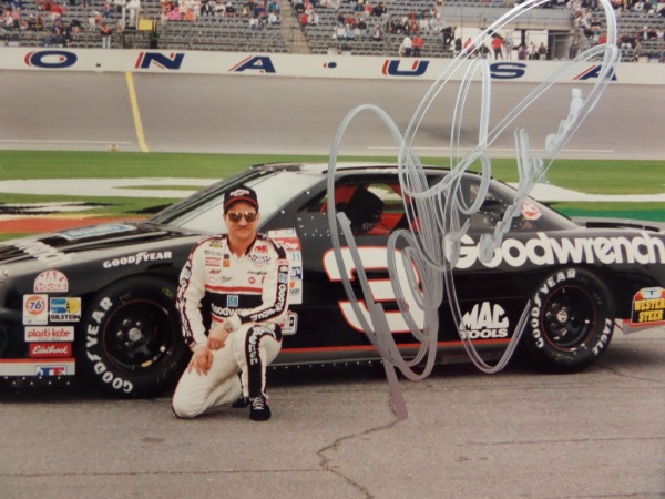 This large color 11x14 shows the late driver with his #3 car, comes IN PERSON signed in terrific silver paint pen, and shows off easy from 15 feet away. Great item, certainty assured by Lee, and value with his death 20 years ago is? 