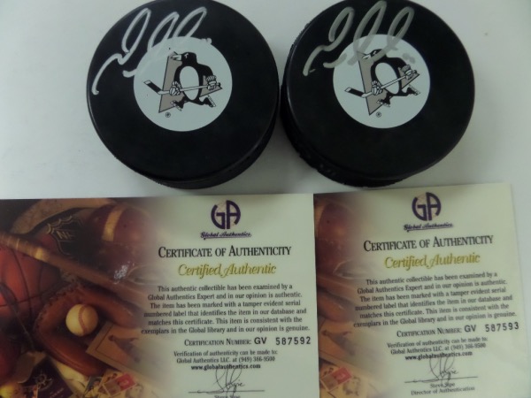 Dealers, buyers, investors, etc, listen up!  Here, we have not one, but TWO Pittsburgh Penguins team logo hockey pucks, and EACH is penned in silver by their all time greatest player, the incomparable Mario Lemieux.  The signatures are strong 8.5's each, and each puck includes a COA and sticker from Global Authentication Inc for certainty.  Each of these great-looking hockey pucks can retail into the mid hundreds, so sell both, or keep one and sell the other, or hey, keep both!