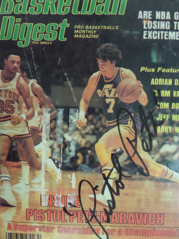 This February 1979 full issue of Basketball Digest is still in VG/VG+ shape, with a color image of Pete Maravich schooling the Knicks as a member of the Jazz.  It is hand-signed in black sharpie by the NBA HOF'er himself, reading "Pistol Pete" and grading a bold, clean 9 overall.  With Maravich's death now nearly 4 decades ago, retail on this piece is easily mid hundreds!