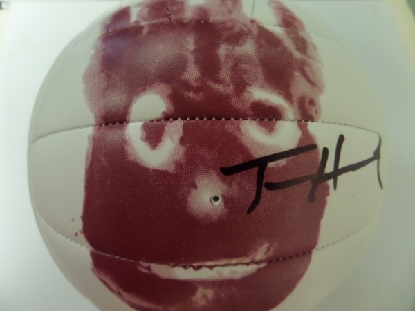 This NM Wilson AVP Official Game Ball features an image of Hanks' friend "Wilson" from the film "Cast Away".  It comes black sharpie signed to the right of the image by the 2 time Academy Award winner, and will make for a spectacular addition to any collection!