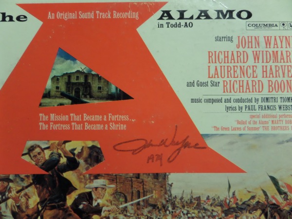 This original motion picture sound track LP album for the 1960 classic, "The Alamo" is hand-signed on the front by the man who played legendary Frontiersman Davy Crockett, John Wayne.  The album comes with a GTE Sports Stars & Memorabilia for authenticity purposes.  Valued into the high hundreds!