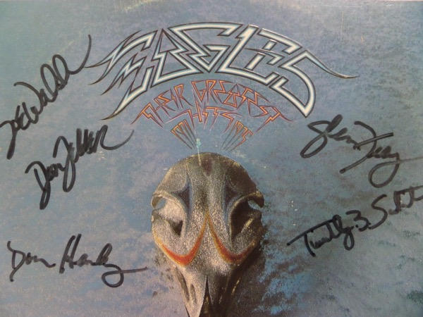 This original 1976 "Eagles Greatest Hits 1971-75" LP album is autographed on the front cover in black felt tip marker by 5 members of this hit 1970's band.  Included are Don Henley, Timothy B. Schmidt, Glenn Frey, Don Felder and Joe Walsh, and this album values into the mid hundreds!  GTE Sports Stars & Memorabilia COA included!