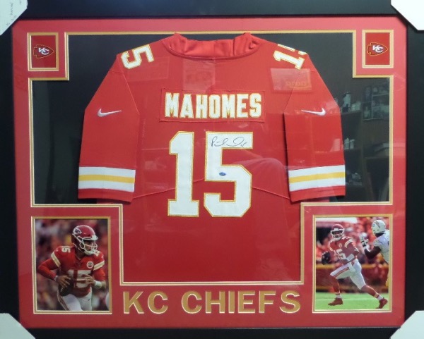 This huge custom wall hanging is about 3x4 FEET in size, and comes to you professionally double matted and framed in team colors. It holds a hand signed pro look jersey, signed in bold black sharpie, and shows off well from across our auction room. It is sure to please, and is a HUGE future HOF show off piece. Can you say certain investment?