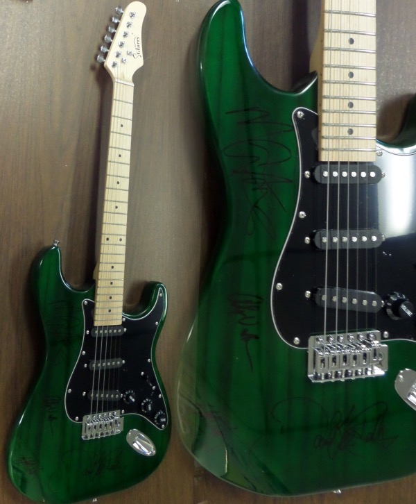 This mint, full-sized  electric guitar is neat-looking green with unique styling and comes hand signed by all 4 bandmates including lead guitarist and now deceased star Eddie Van Halen,Alex,Michael, and David Lee Roth!   It comes IN PERSON obtained, grades as good as it gets on the mint guitar, and shows off well from 30+ feet away. Great musical investment in the well known Rock N Roll group, and is complete with Lee's own lifetime guarantee included and original carry bag,etc.. WOW!