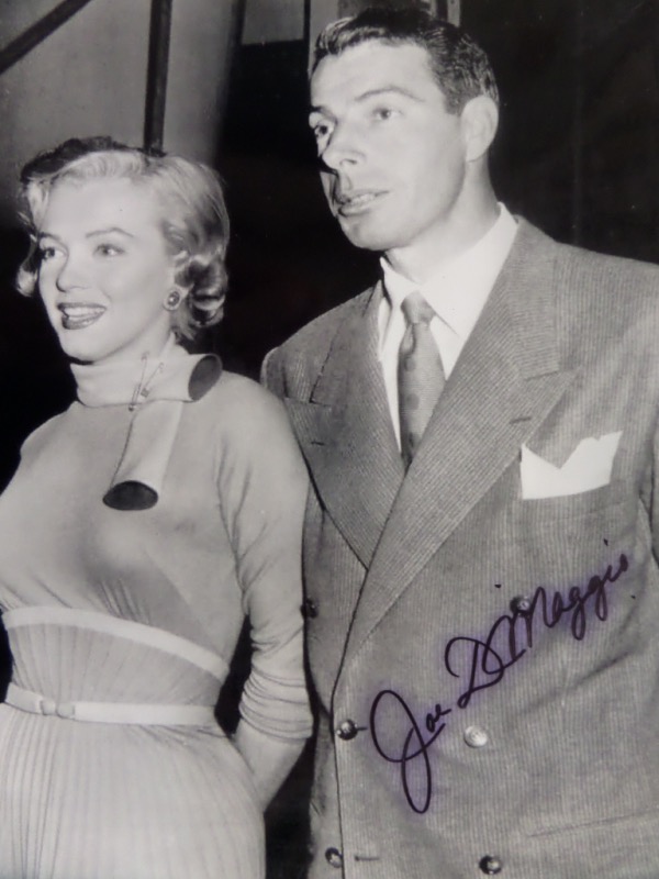 This black and white 8x10 photo shows Joe DiMaggio and Marilyn Monroe as a married couple in the 1950's.  It is hand-signed in black sharpie by the HOF Yankee Clipper himself, grading a legible 7.5, and comes with a COA from JLA Authentics for authenticity.  A RARE image, and retail is mid hundreds!