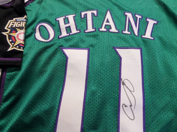 This very rare Nippon League road green is trimmed in purple and white team colors, has sewn on everything as well as name on back, and comes back #11 signed by the best player in the Bigs. It is a must have buy and hold MLB investment, value is about $1500.00 IF you can find one, and as always, we'll sell it with NO reserve here at the "Corner". 