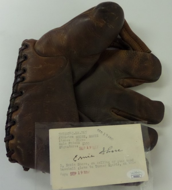 This well used glove belonged to Ernie Shore circa 1915-1917 or so, and comes with a JSA COA on Ernie's hand written note card. It was his glove, but he claims that THE Babe Ruth used it several times in 1915 and 1916. Of course we have no way of authenticating this, but old timers don't lie...The glove lays flat, shows nice Big League usage, and is a buttonback model from Wilson. 