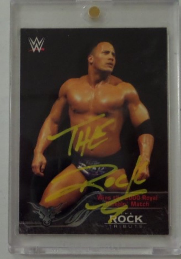 This slabbed and locked in card is a color gem from the WWF and Topps, and comes paint pen signed perfectly across the front by the Samoan star turned Hollywood legend. It is a clean bold 10 all over, has the numbered hologram on the back for proof, and value is ??