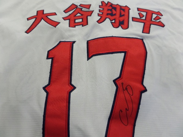 This white size L custom #16 Japan Ohtani jersey is in NEW condition, with everything hand-sewn.  It is back number-signed in bright silver by the 2021 AL MVP himself, written in both English and Japanese, grading an 8 at least.  A great looking jersey, and retail is high hundreds right now at least!