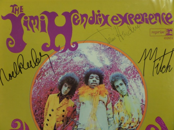 This vintage 1967 "Are You Experienced" LP album from The Jimi Hendrix Experience is in EX overall condition, and comes front cover-signed in black ink by the long-deceased guitar great himself, and in black sharpie by Noel Redding and Mitch Mitchell.  The signatures grade strong, legible 8's overall, and with Hendrix untimely and tragic death over FIFTY years ago, this piece values into the low thousands!!!