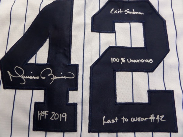 This home white, pinstriped size L NY Yanks jersey from Nike is like new, and comes to us with everything sewn.  It is back number-signed in bright silver by the greatest closer EVER, complete with the following inscriptions: Exit Sandmand, 100% Unanimous, HOF 2019 and Last to wear #42.  A fantastic NYY item, valued into the mid/high hundreds, especially with these cool inscriptions added!