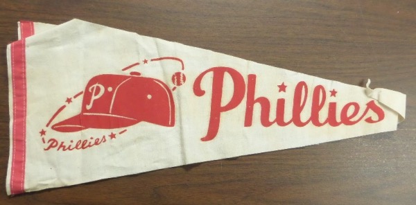 This roughly 30" long Philadelphia Phillies team pennant is in red and white colors, and at least 50 years old, and probably closer to 60!  It is completely intact but shows a bit of toning, aging and folding, and a grade of VG/VG+ would probably be in order.  It will make a wonderful addition to any Fightin Phils collection, and retail is probably mid hundreds!!!