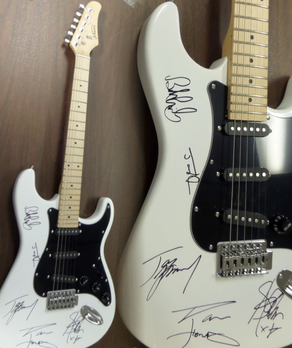 This mint GORGEOUS electric guitar comes body signed by all five members of this iconic hard rock band!  Included are Hamilton, Kramer, Perry, Tyler and Whitford, all in bold black sharpies, and this baby will show off in Hard Rock Cafe style!  Valued into the low thousands+++ and comes with original carry case, bag, pick ups etc.. WOW Guaranteed authentic. 