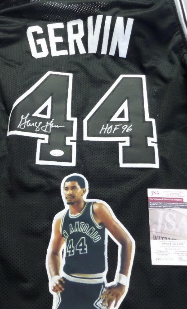 This 1976 styled San Antonio road black is trimmed in grey and white old tyme team colors, has sewn on everything as well as name on back, and comes with a full likeness of the "Iceman" stitched onto the back side. It is quite the looker, comes back #44 signed by the aging fast HOF'er, and has a full JSA "Witnessed" COA and matching hologram intact! 