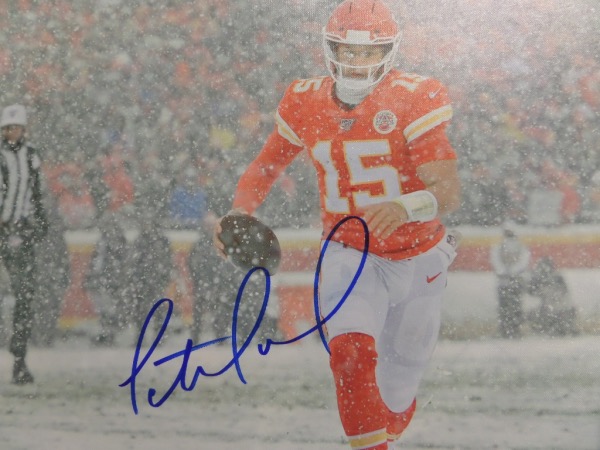 This real canvas work is a gem, shows the NFL future HOF star in a blizzard in KC, and comes boldly, blue marker signed on a terrific spot. It grades a clean bold 10 all over, measures a whopping 20x24 in size, and value is over two grand for sure. 