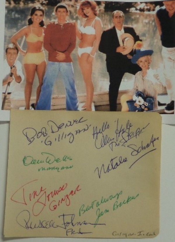 This full autograph album page has rounded edges on the right, is in EX/MT shape, and measures just a tad above 4x5 in size.  It is hand-signed in blue, red and green by 7 cast members from the hit 1960's comedy series, including Denver, Hale, Schaeffer, Wells, Louise, Johnson and Backus, and comes with a color photo for matting and framing, and with 5 of the 7 no longer with us, retail is low thousands on this RARE item!