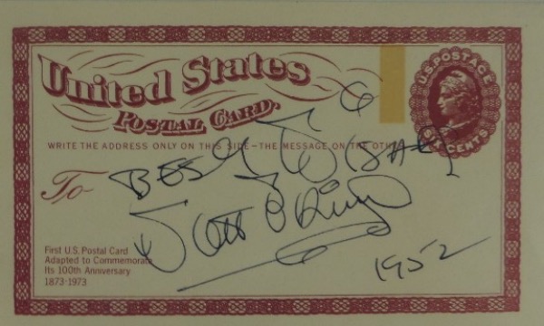 This very old 6cent United States Government postcard is still in EX/MT shape overall.  It is hand-signed in black ink by the entertainment icon himself, grading a legible 7 with Best Wishes and 1952 added in his hand, and retail from this long-deceased legend is low thousands!