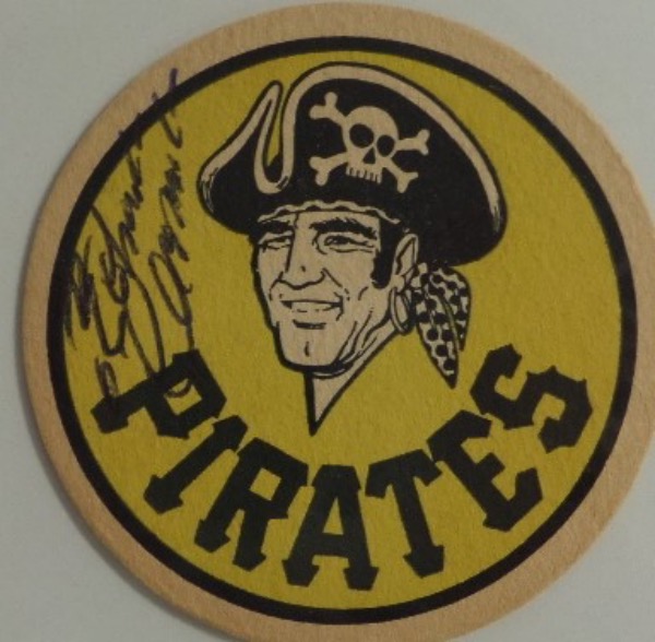 This 3.5" diameter Pittsburgh Pirates team logo drink coaster from Iron City Beer is still in EX shape overall, and comes hand-signed in black ink by their most famous HOF'er, all time great outfielder, Roberto Clemente.  The signature grades about a 6 overall, and with Clemente's death now a half century ago, retail is low thousands!