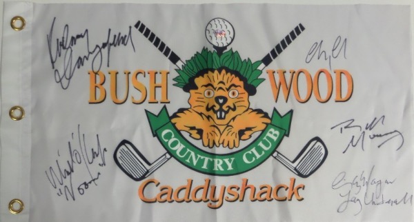This white "Bushwood Country Club" pin flag from the movie Caddyshack has been black marker signed by 5 cast members, including Chevy Chase, Bill Murray, Michael O'Keefe, Cindy Morgan, and the late Rodney Dangerfield.  All signatures grade 9's or better on this piece that is a must have for fans of the classic comedy, and values into the high hundreds and nice!