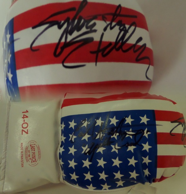 This mint lace-up  ounce 14 ounce glove has the US flag on it and comes signed GORGEOUSLY by both of these ROCKY superstars in black sharpie with Carl including "Apollo Creed" with his autograph! Ideal display glove and guaranteed authentic. Retails in the high hundreds+. Rare.